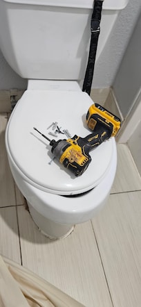 Toilet seat too small for the toilet, the screw gun was because I asked them to rehang the shower curtain. It looked like someone had hung on it.