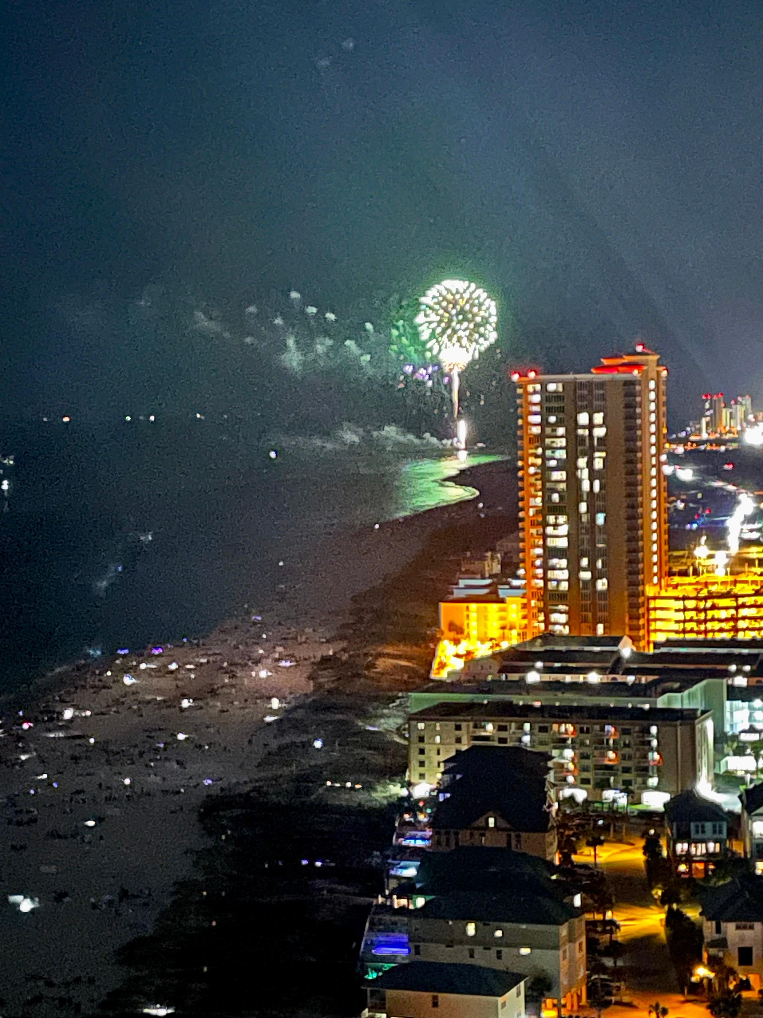 Fireworks from balcony. Tuned into radio station broadcasting simultaneously 