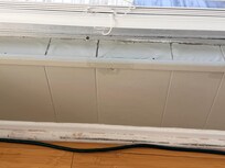 One of several peeling windowsills from prior water damage