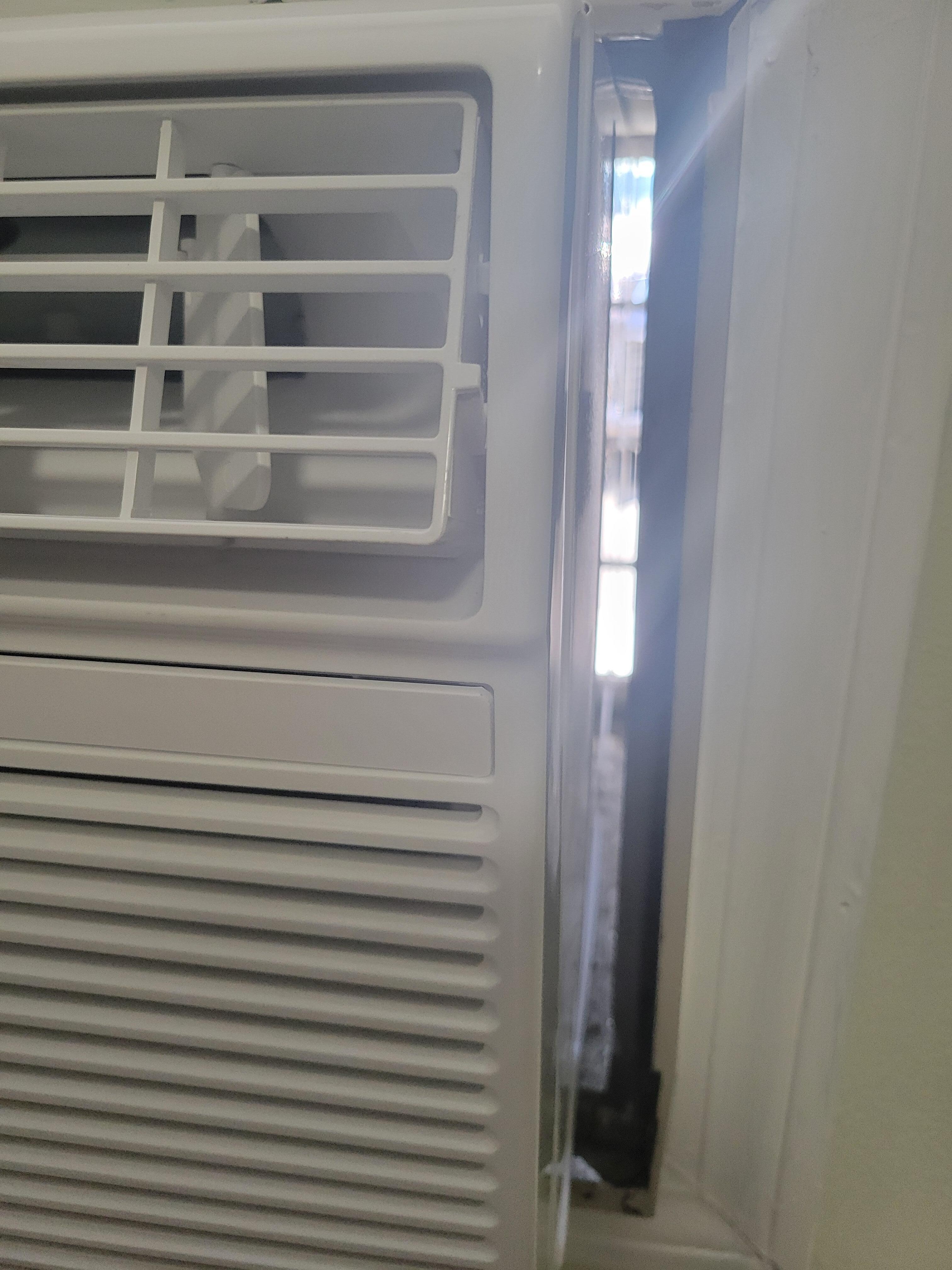 You can see outside thru the space next to A/C, and screen is ripped on window
