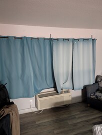 This is what I saw when I walked into the room. Sun damage curtains that the belong in a dumpster...