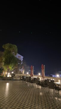 Facing the mountains and the mall.