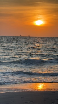 Sunset at the beach across the street