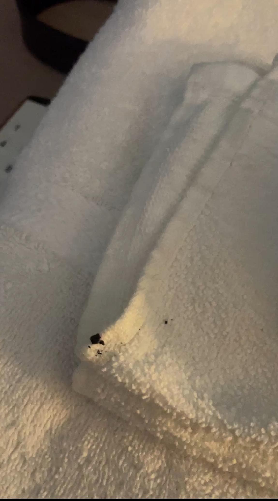 Black crust on the towel