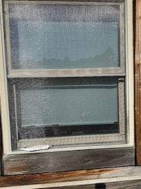 Torn screen, when we got there, in master bedroom bathroom.