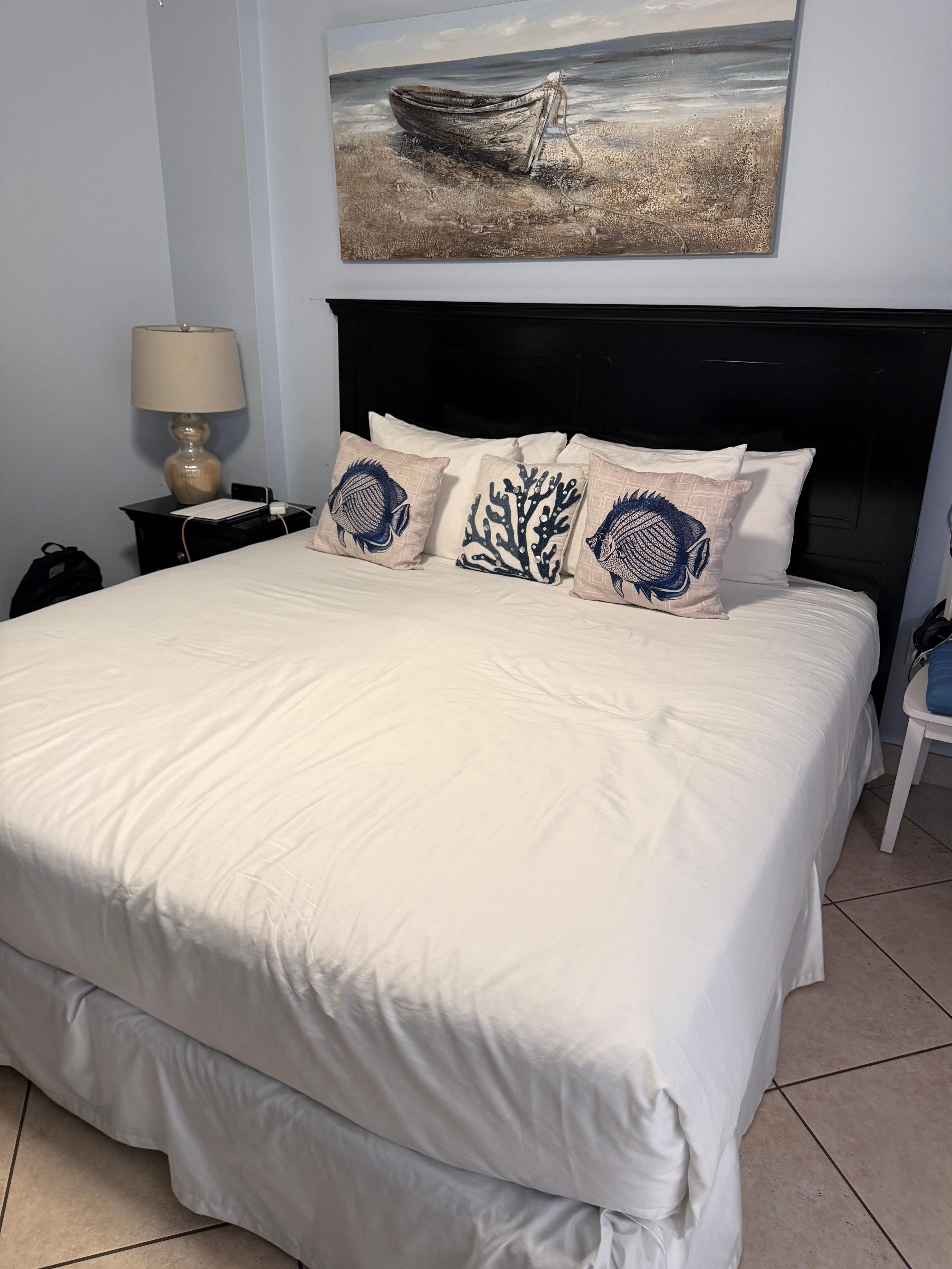 Comfortable master bed. Quality linens and nicely themed details. 