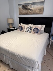 Comfortable master bed. Quality linens and nicely themed details.