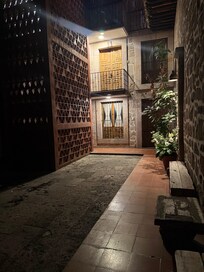 Courtyard towards the back of the hotel during the night.