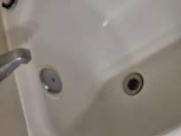 Tub plug was out. Did not drain. You stood in 2 inches water
