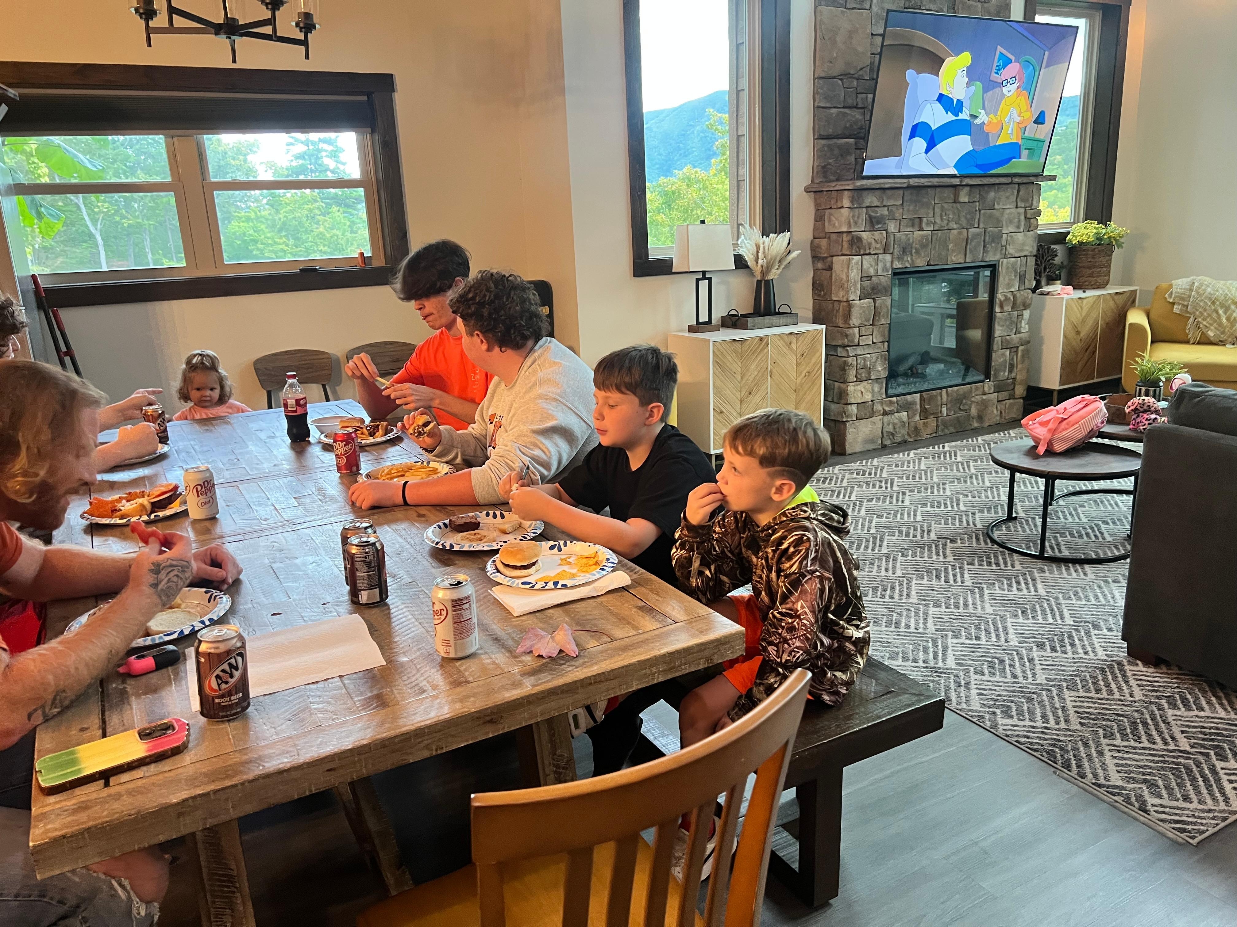 Family supper after a day of zip lining and playing 