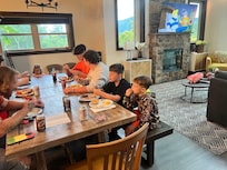 Family supper after a day of zip lining and playing