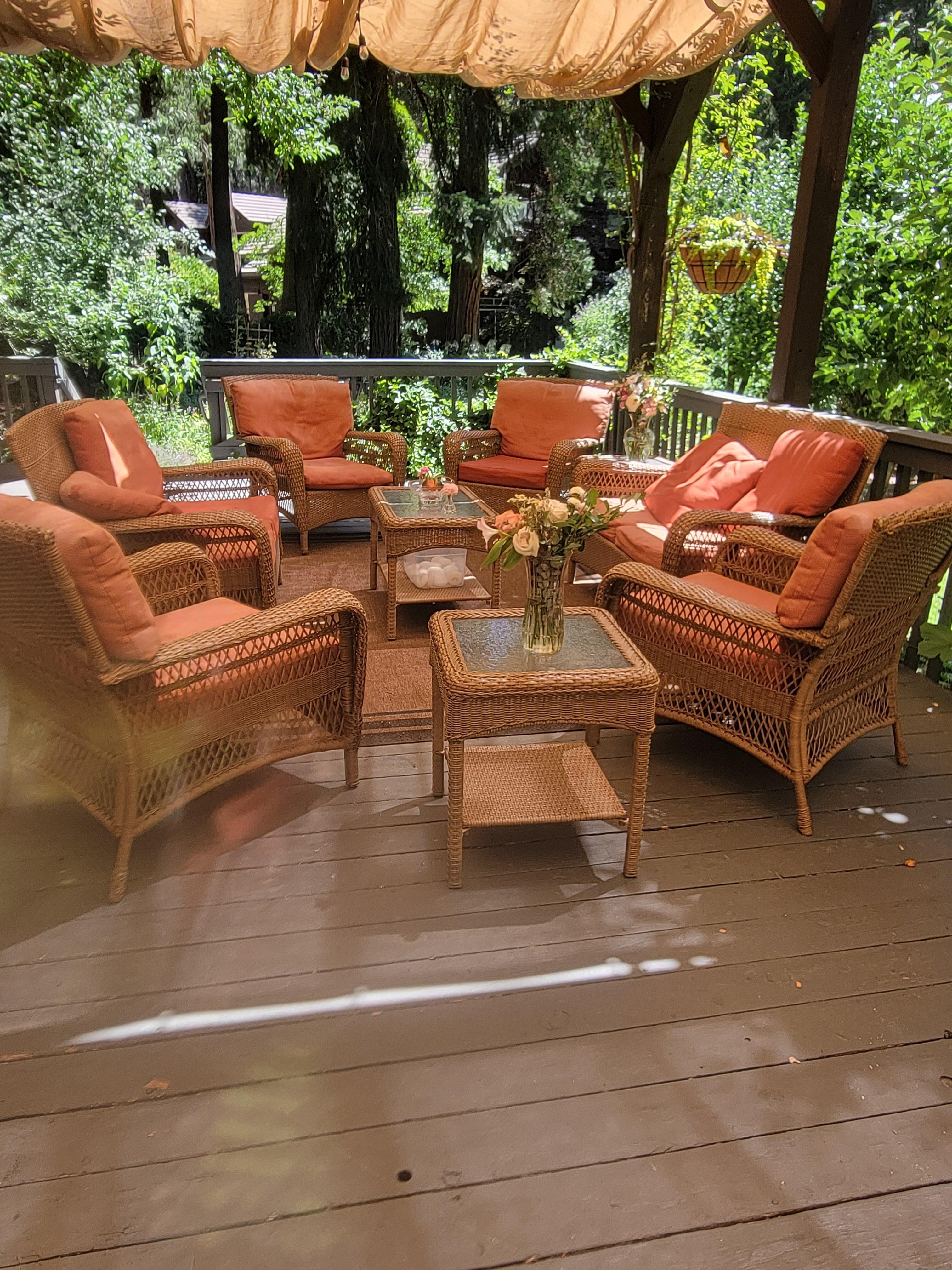 Seating for a large group up on the patio with fresh cut flowers
