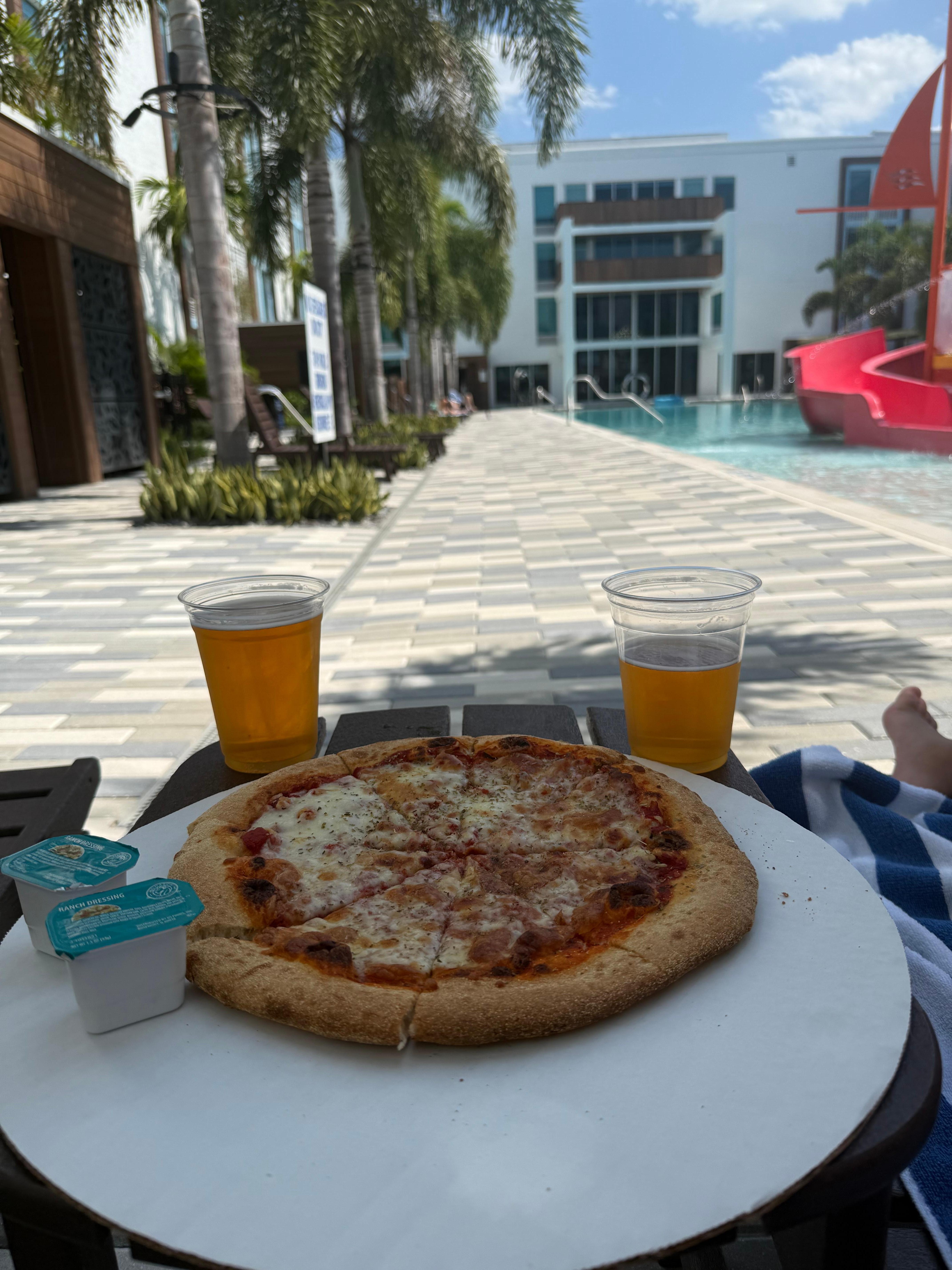 Cheese pizza and beer from the pool bar. 