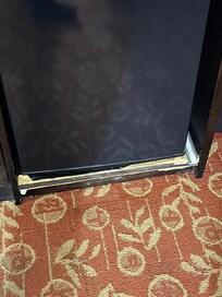 Dressed was damaged and broken under fridge