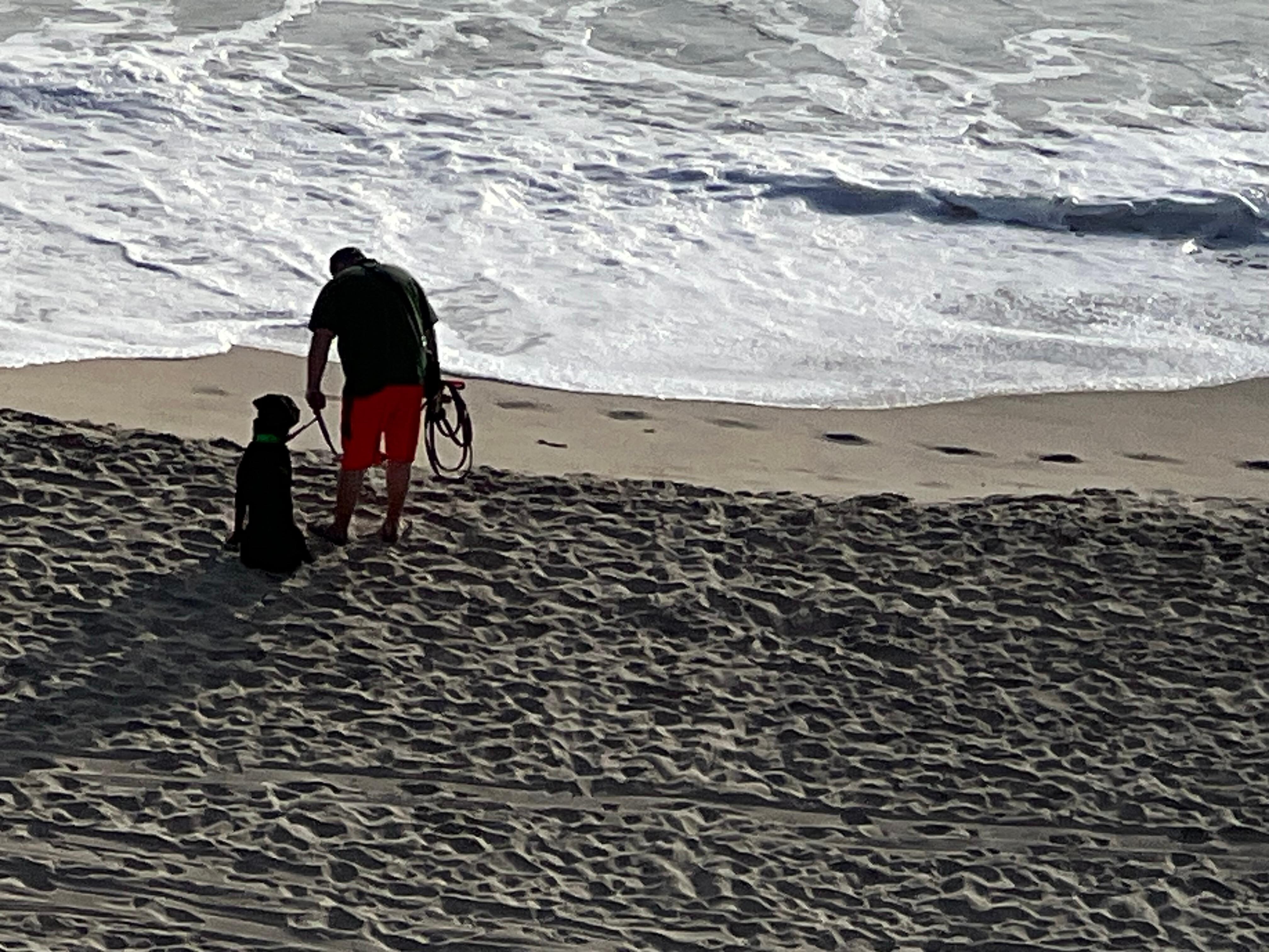 Matteo and his dad on an early morning beach walk 