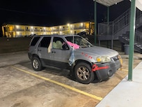 Car parked in front of rooms
