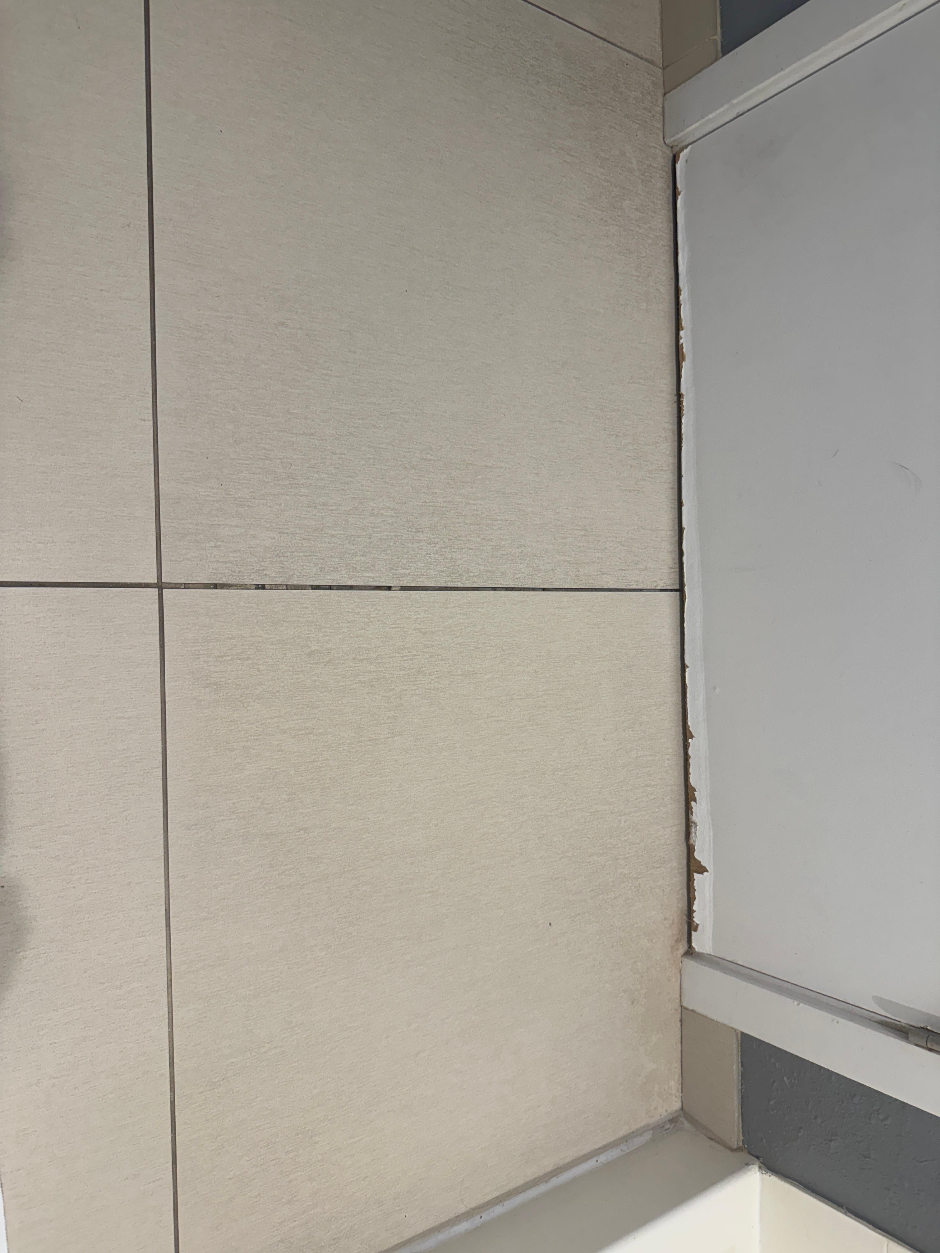 Broken and loose tile in the room from excessive water damage and the floor was soft.  