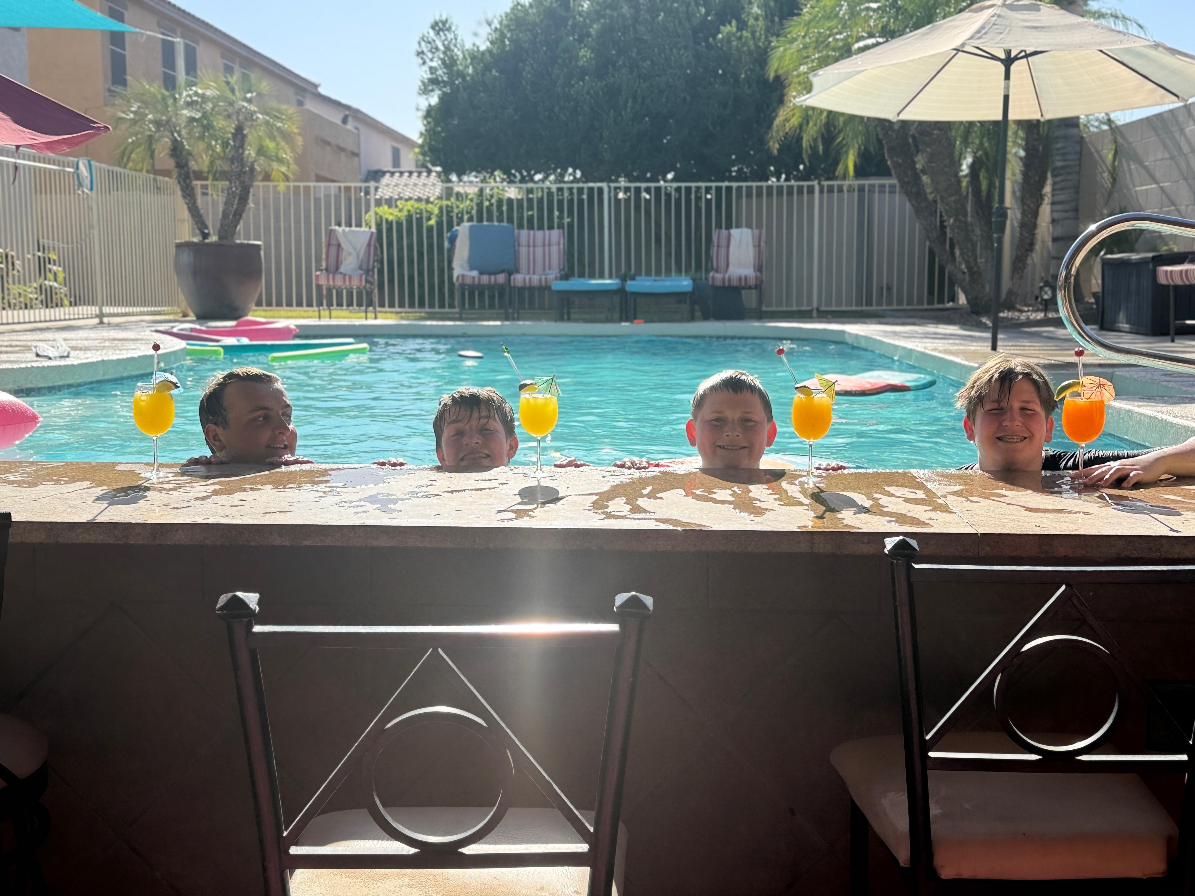 Kids with their “mocktails” by the pool. Orange juice mixed with Sprite or Mountain Dew. 
