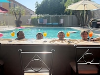 Kids with their “mocktails” by the pool. Orange juice mixed with Sprite or Mountain Dew.