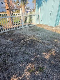The dirt/debris that surrounded the yard and pool.