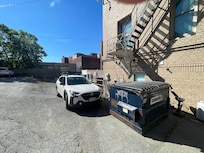 Owner directs you to park in a NO PARKING zone by a dumpster.