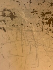 Scuffed floors with peeling paint