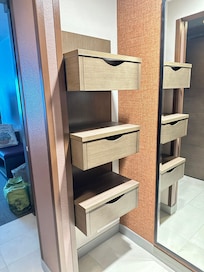 Closet with drawers and shelves.