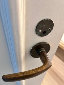 Outdated door handles with old paint