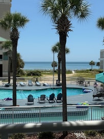View of beach. Great pool! Lazy river was excellent! All hotel guest did rinse before entering so very little sand in the pool.