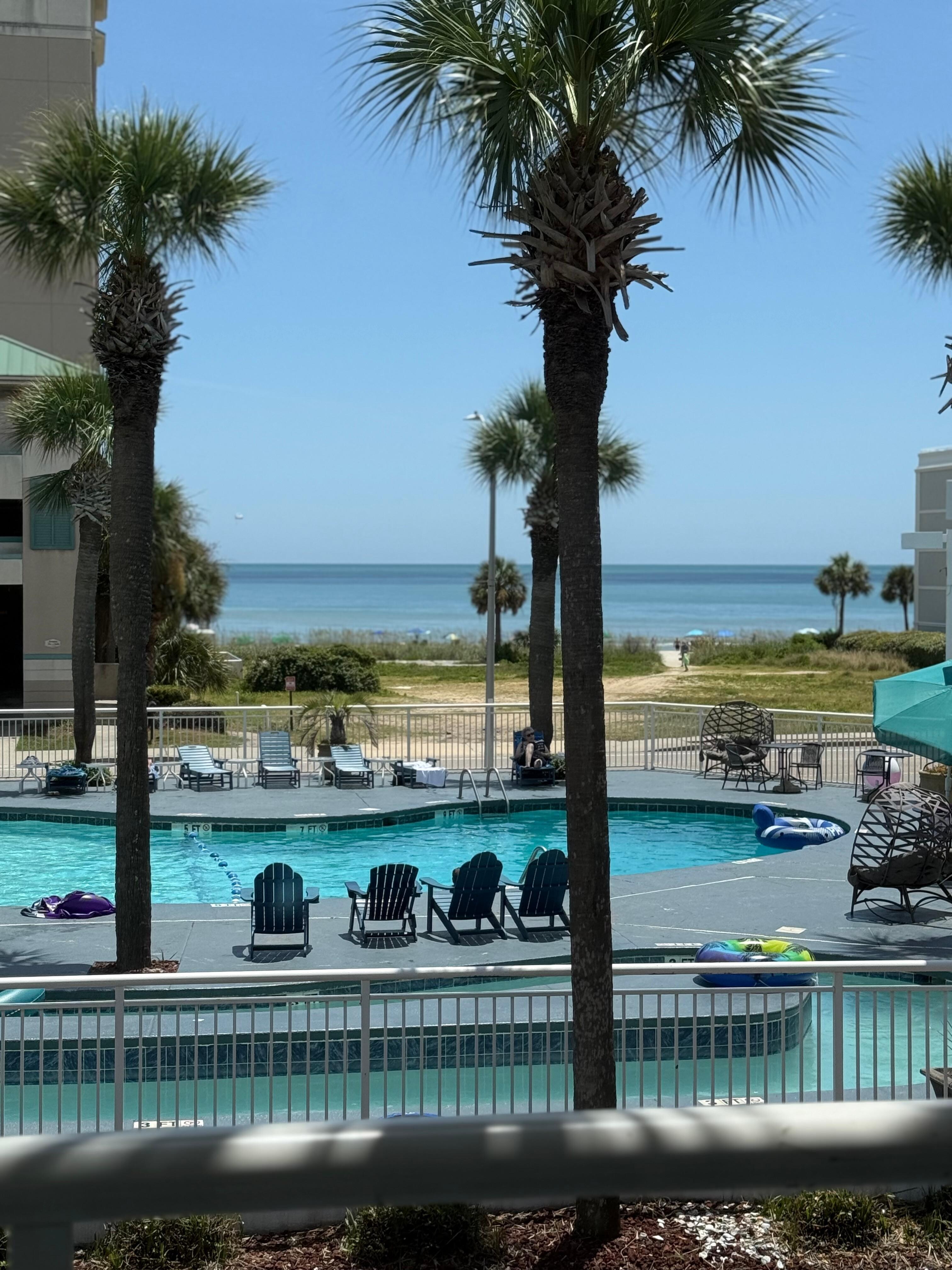 View of beach. Great pool! Lazy river was excellent! All hotel guest did rinse before entering so very little sand in the pool. 