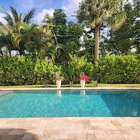 View of pool from outdoor dining area.