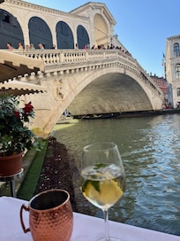 1 min walk and great place to enjoy a drink. Best people watching ever