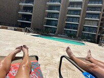 Laying out by one of the pools.