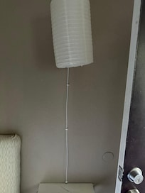 Paper lighting fixture stapled to the wall - no hard fixtures as posted on the website
