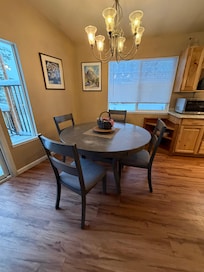 a dining Table next to the kitchen