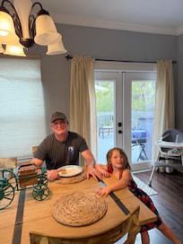 My husband and our granddaughter having some breakfast