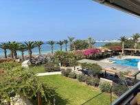 Beautiful gardens leading down to sandy beach and turquoise Mediterranean