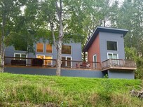 Back of house shows separate bedrooms