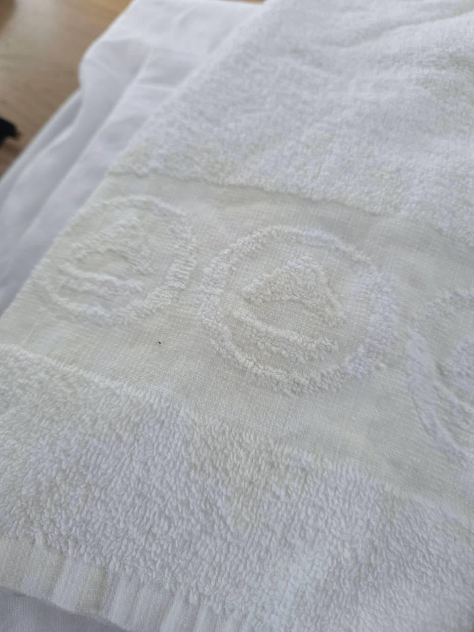 yellow stain on towel that we had to RENT along with sheets for 73 EUROS