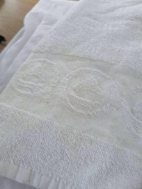 yellow stain on towel that we had to RENT along with sheets for 73 EUROS