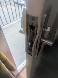 Not only was the door completely bent out of shape here, but the frame at the bottom was also bent so that the door didn't close all the way.