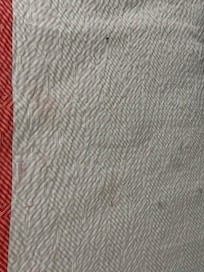 Stains and burn holes on comforters.