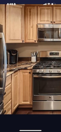 Ad for condo kitchen showing Keurig coffee maker.