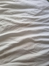 Dirt on the bed cover