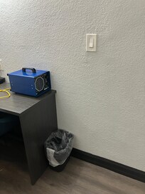 Noisy, blue contraption for odor control. I was able to shut it off.