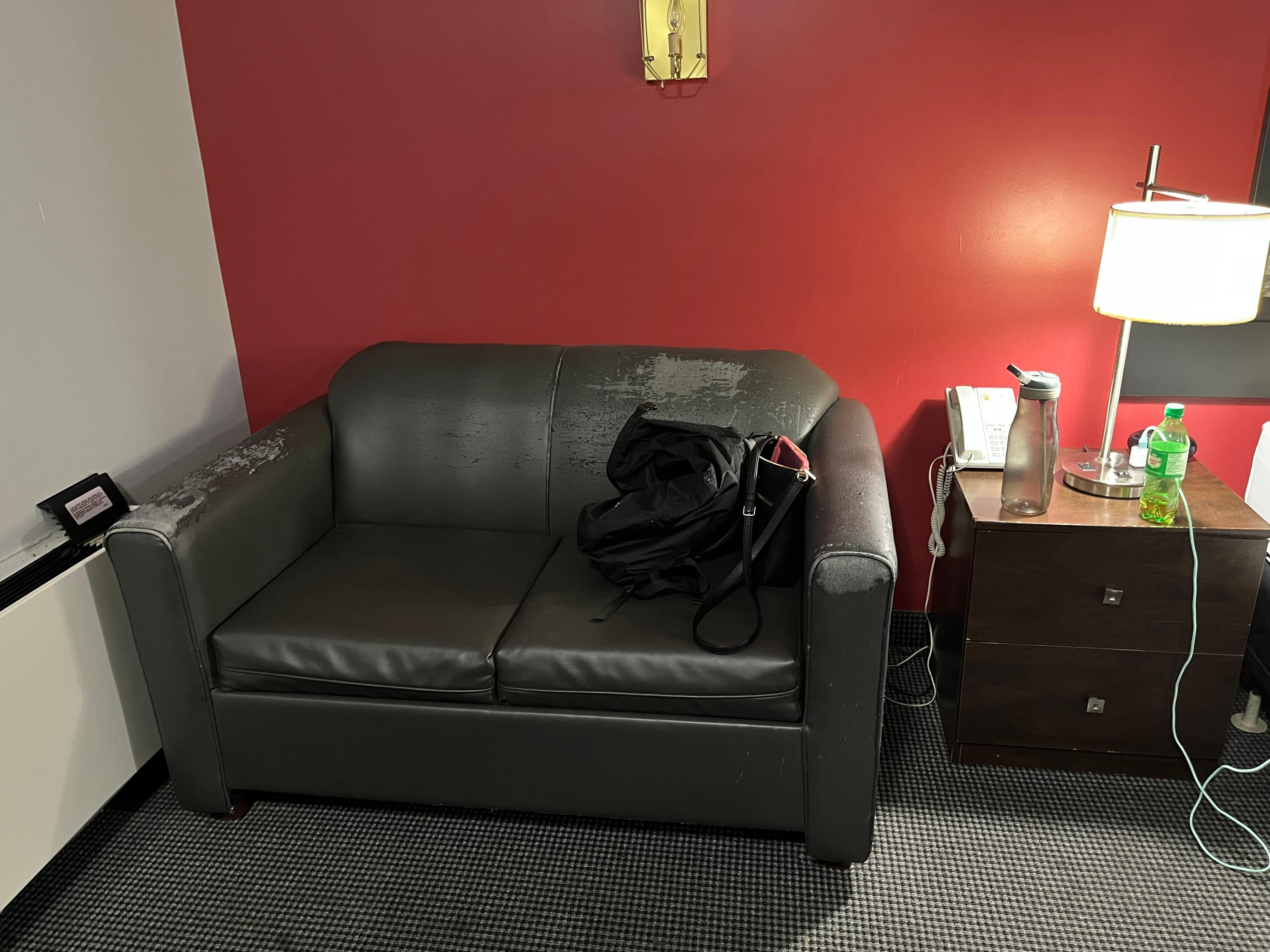 Again worn out and dirty couch 
