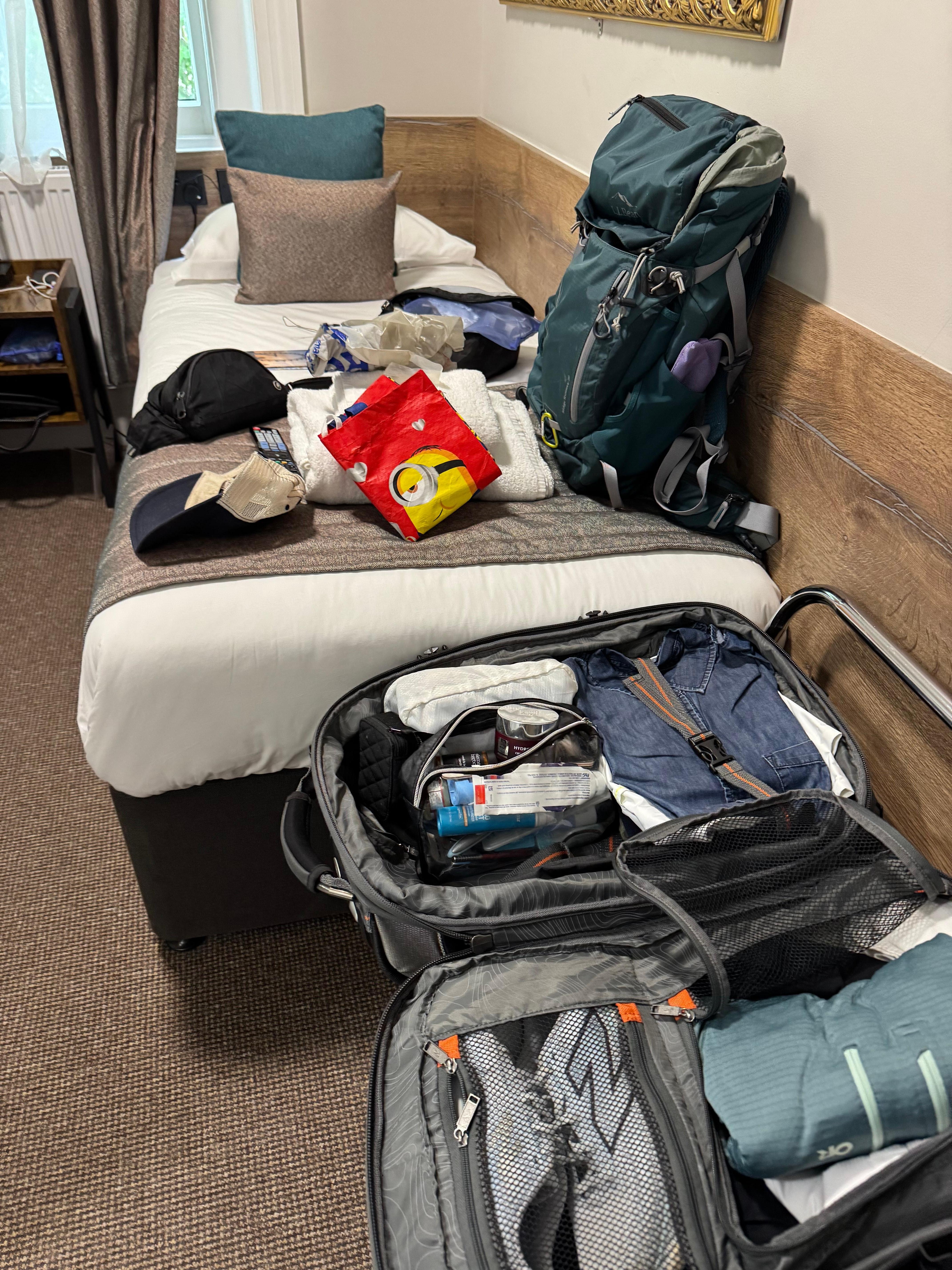 Luggage eventually stored under bed.
