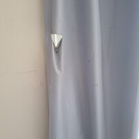 Torn because nailed to frame