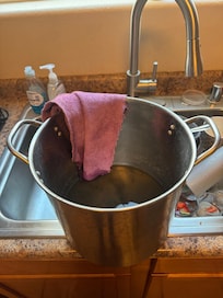 Pot under the sink because disposal was leaking