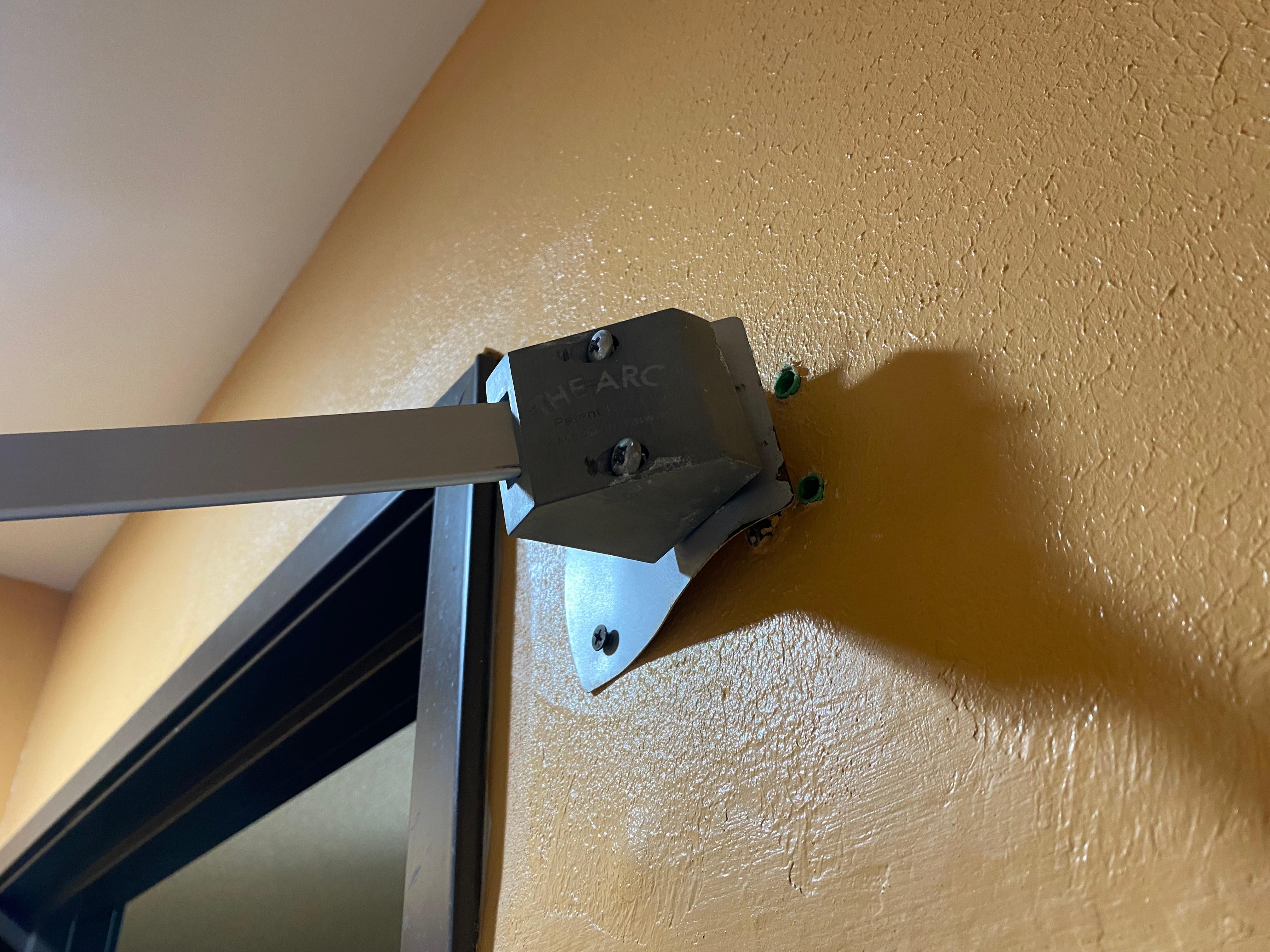 Shower curtain falling out of wall